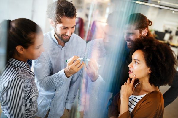 Collaboration and analysis by business people working in office