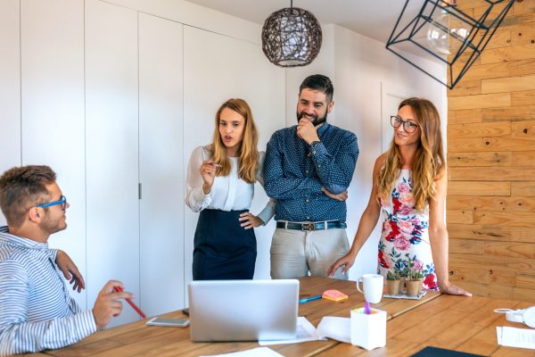 Management team congratulating an employee Management team congratulating an employee
