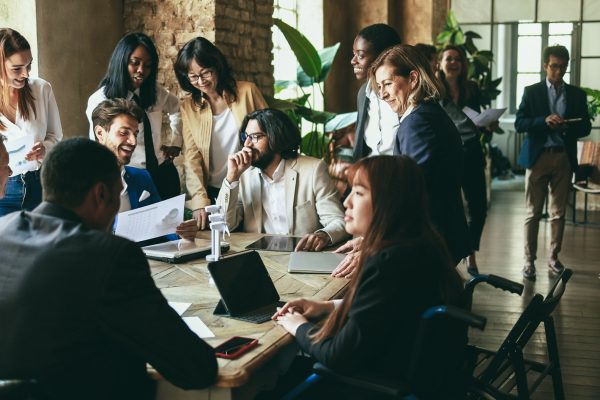 Multiracial business people working on sustainable innovation project Multiracial business people working on sustainable innovation project